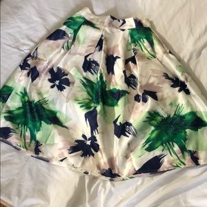 Off white with green and blue flower like pattern